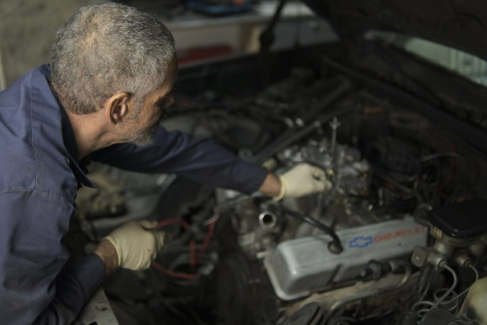 Mechanic working in an engine bay