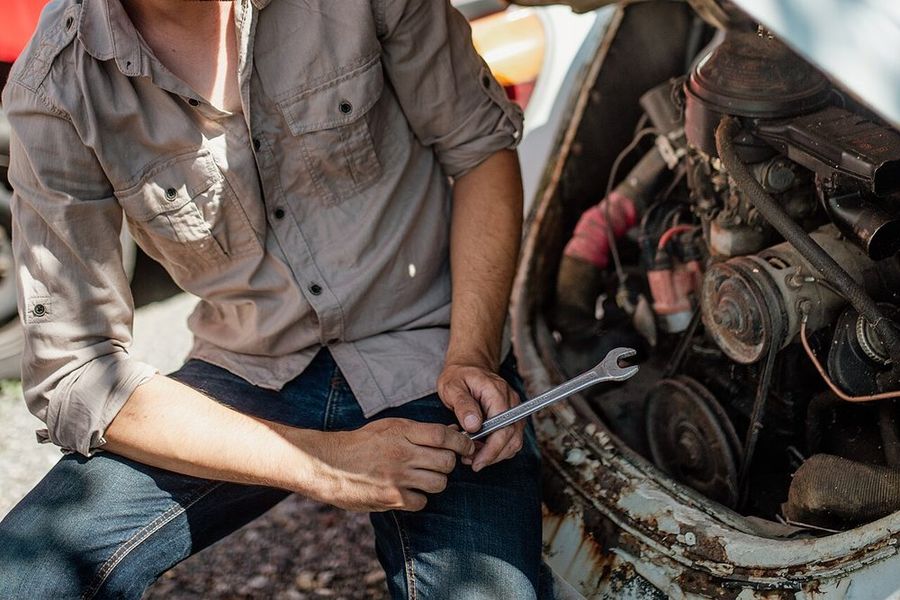 Wrenching on an engine under the hood